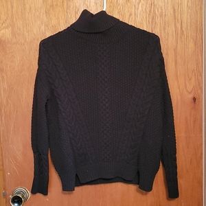 Black cable knit turtleneck sweater